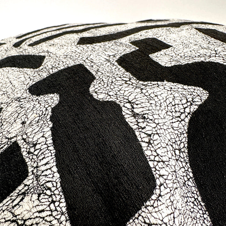 Black-and-white bogo marks pillow cover fabric close-up