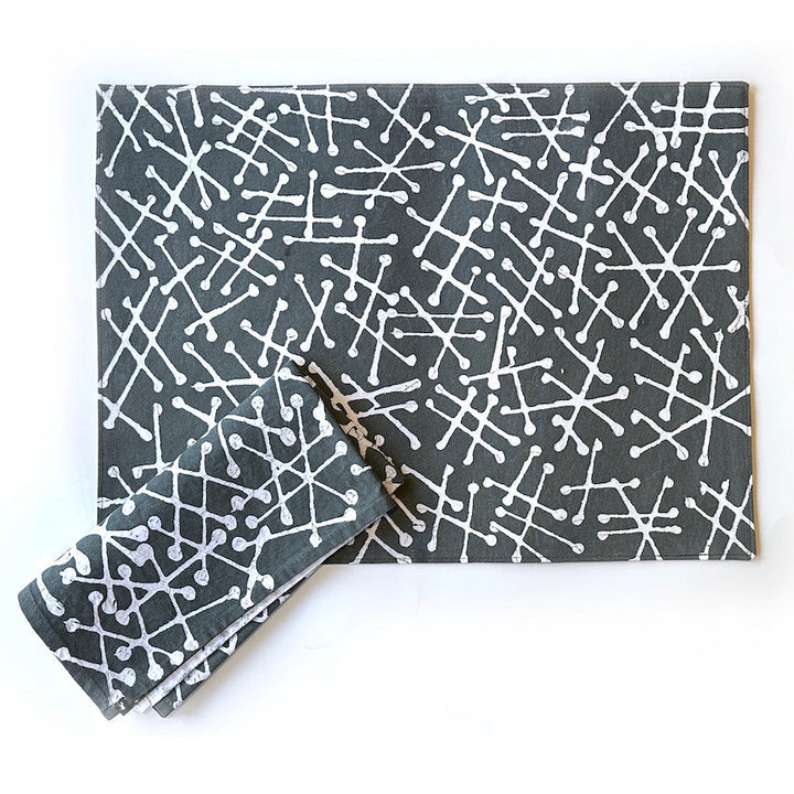 Set of 2 gray placemats with white geometric line pattern, stacked and folded