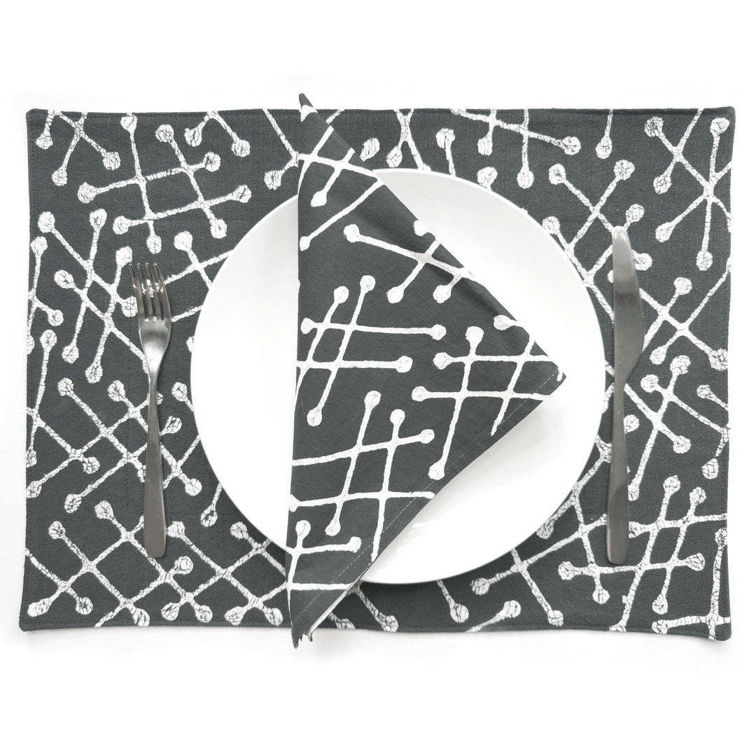 Set of 2 gray placemats with white geometric line pattern, under plate and fork