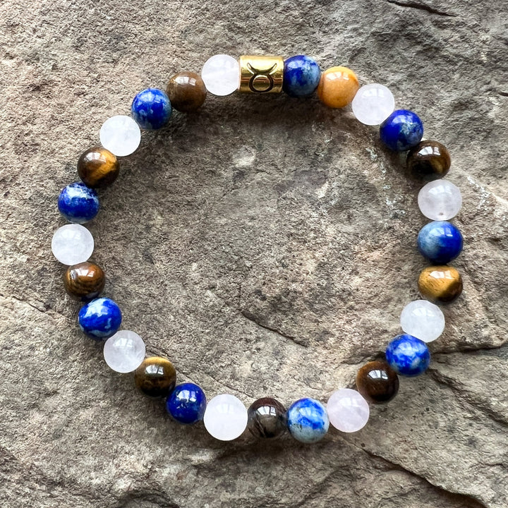 Taurus zodiac bracelet with blue round beads, white stones, brown beads, gold center