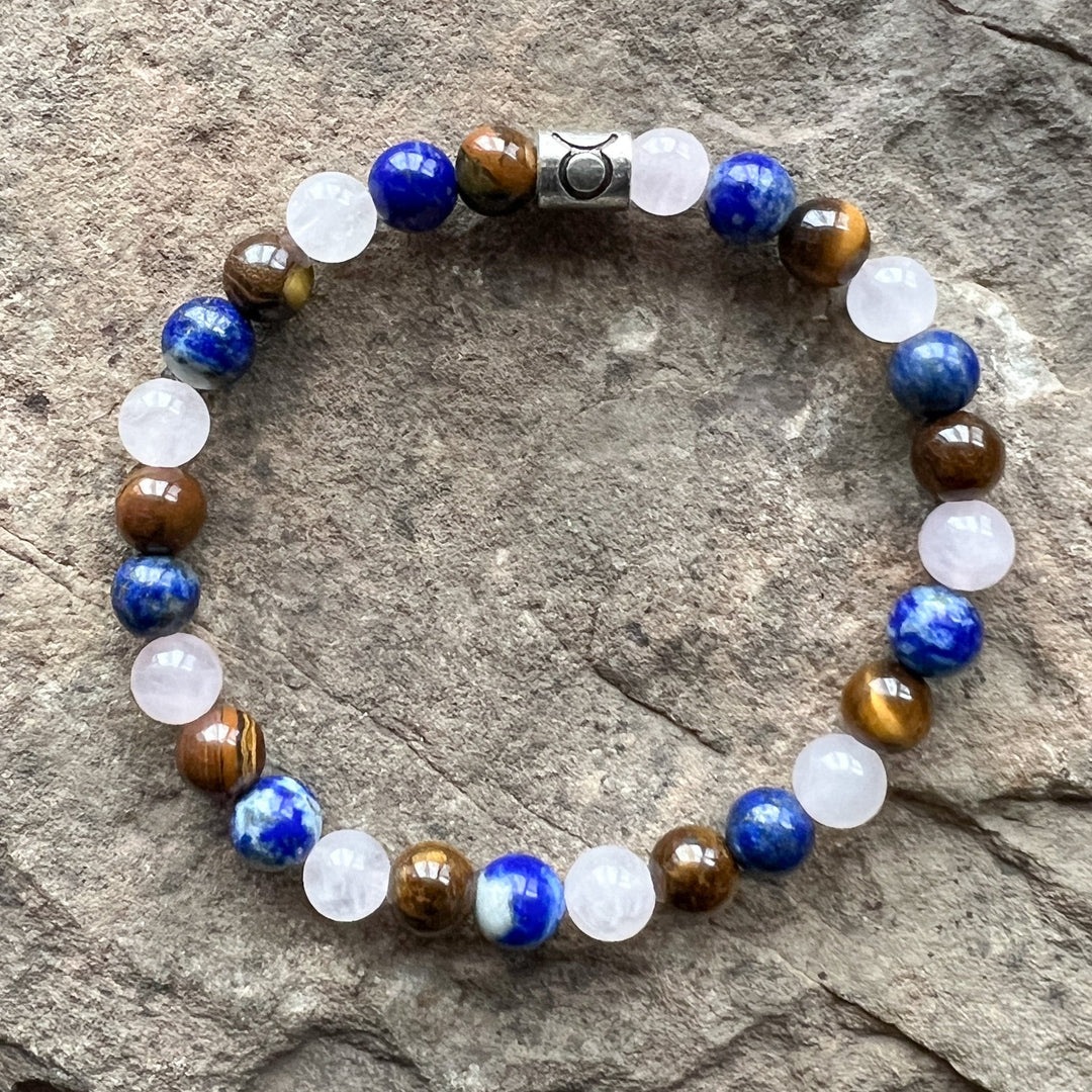 Taurus zodiac bracelet with blue, white, and brown beads and silver-toned clasp