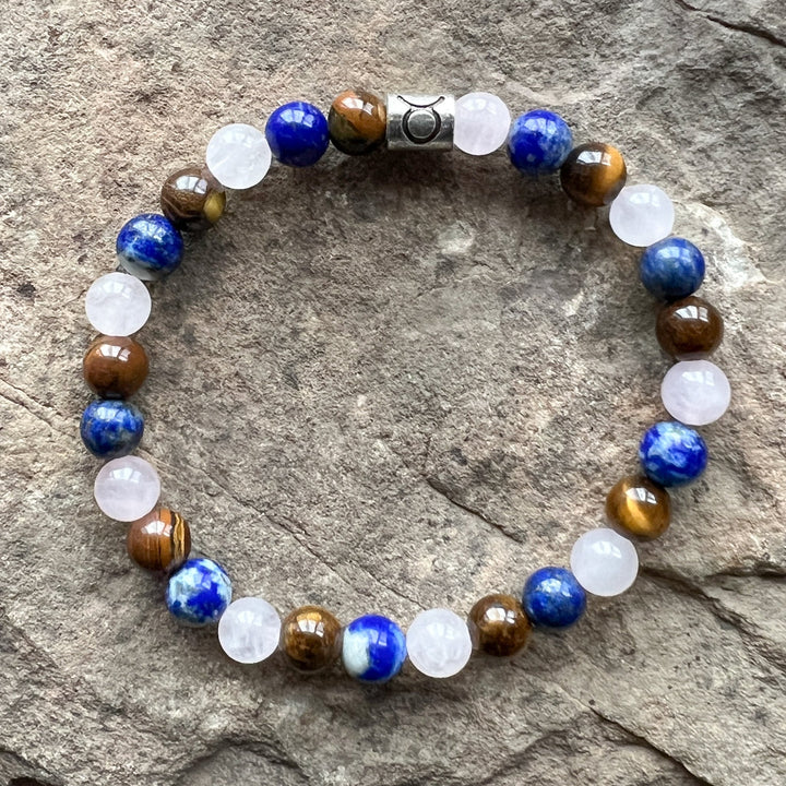 Taurus zodiac bracelet with blue, white, and brown beads and silver-toned clasp