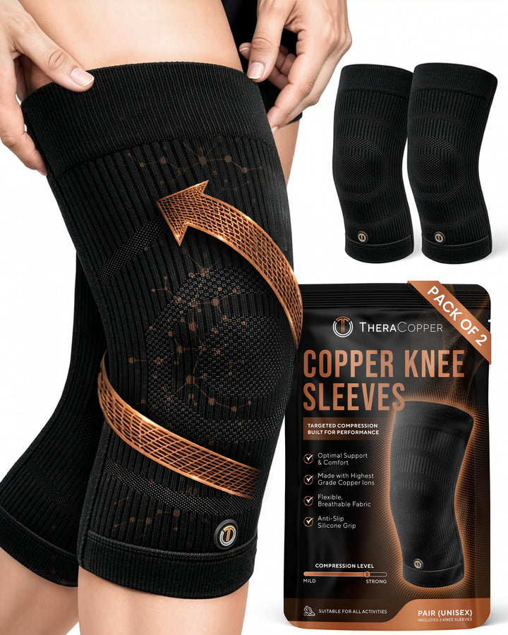 Pair of black compression knee sleeves with copper accent grip panels and logo patch