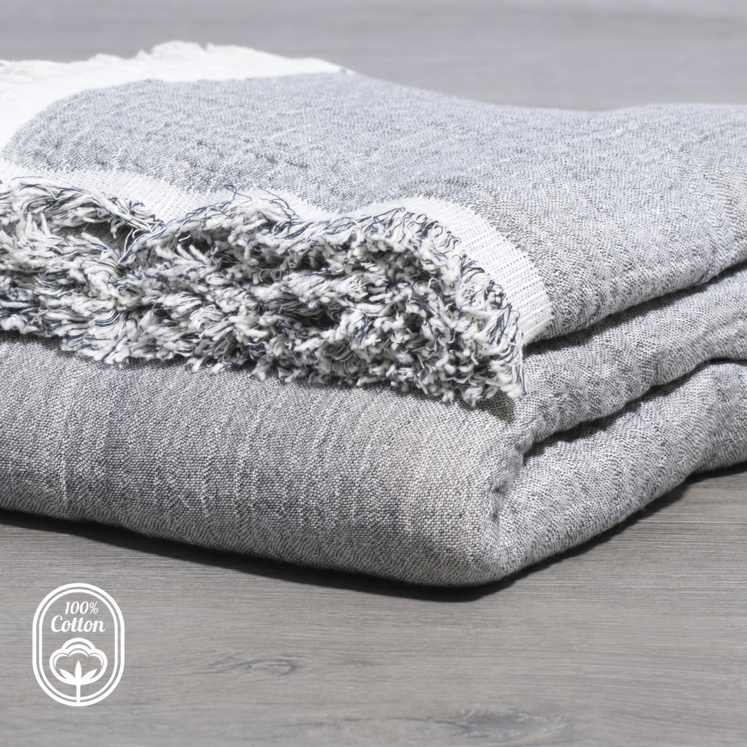 Grey reversible muslin throw blanket with fringed edge, folded