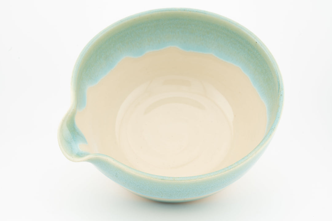 Ceramic bowl with optional spout, teal outer glaze and cream interior, top view