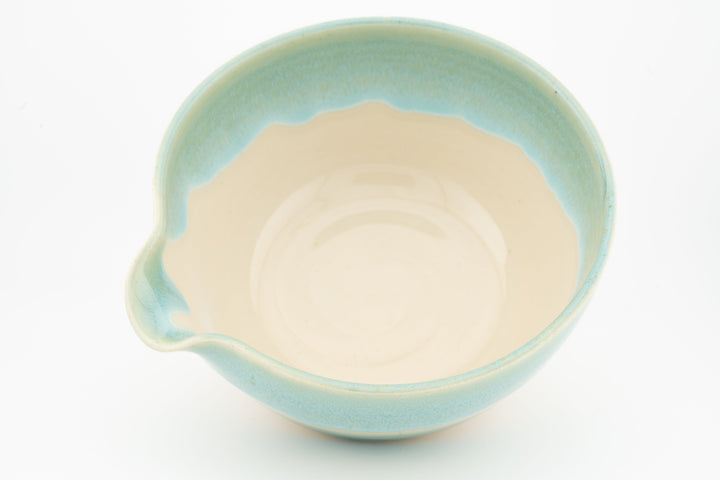 Ceramic bowl with optional spout, teal outer glaze and cream interior, top view