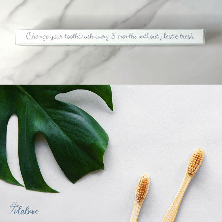 Bamboo toothbrush twin pack with two wooden handles and orange bristle heads