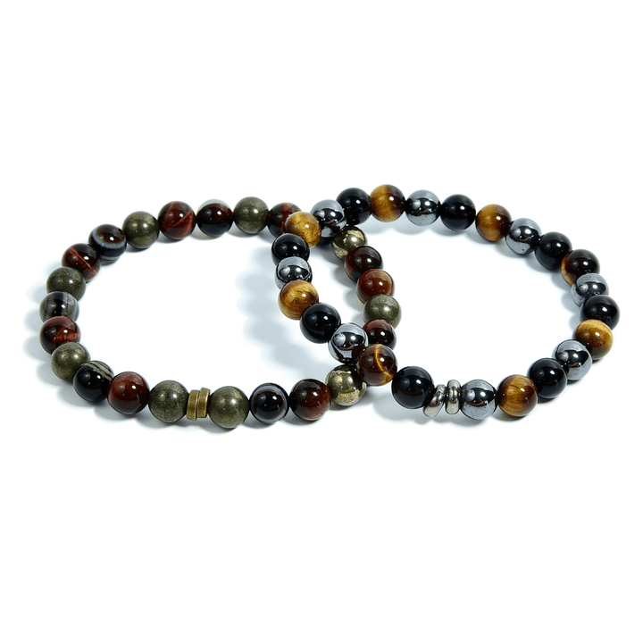 Set of tiger eye bead bracelets on white background, black and brown stones with gold tones.