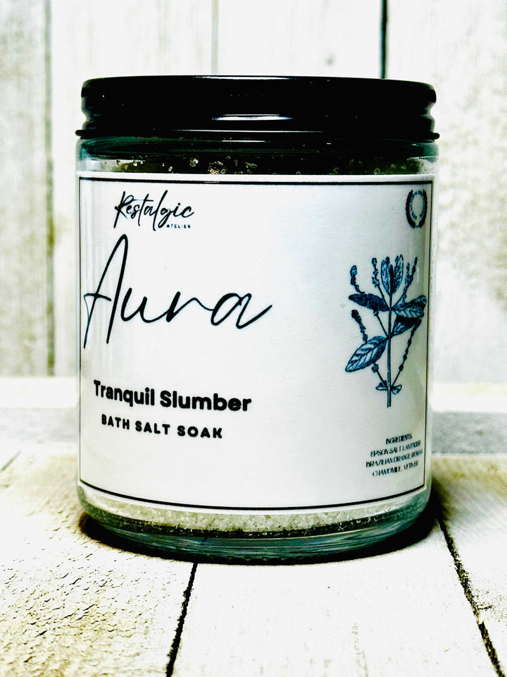 Tranquil Slumber bath salt soak jar with blue flower label and black lid