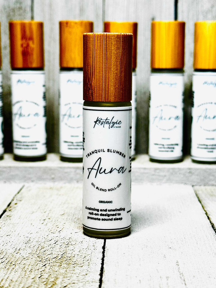 Tranquil Slumber roll-on bottle with wooden cap, displayed with other bottles