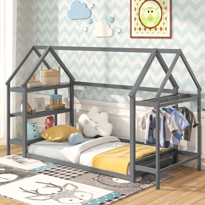 Grey house-style Montessori floor bed frame with open storage shelves and roof rails