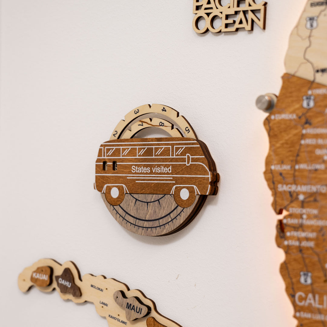 Wooden car-shaped USA travel tracker with “States visited” label and circular gauge.