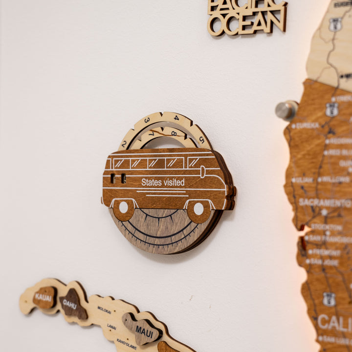 Wooden car-shaped USA travel tracker with “States visited” label and circular gauge.