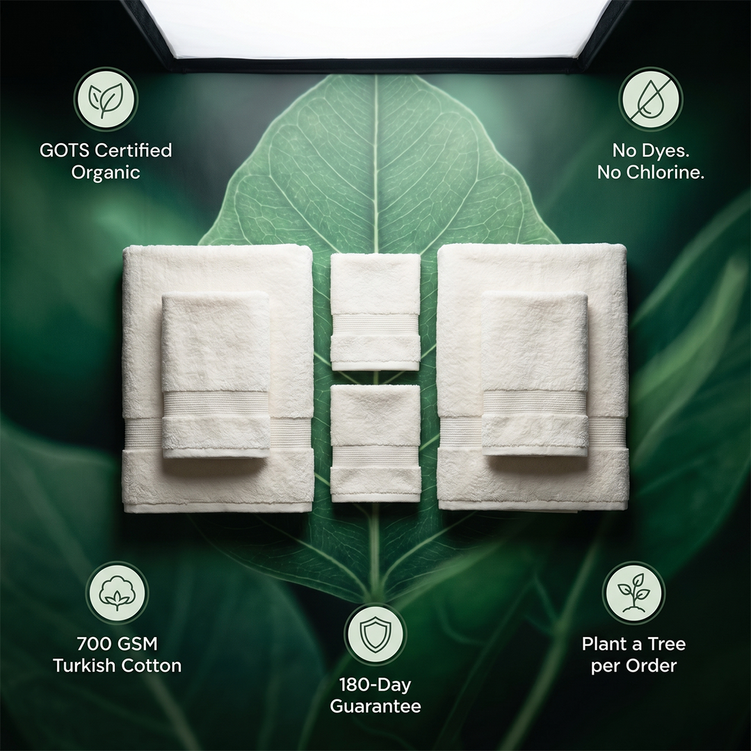 White bath towel set displayed with six folded towels, plush terry texture
