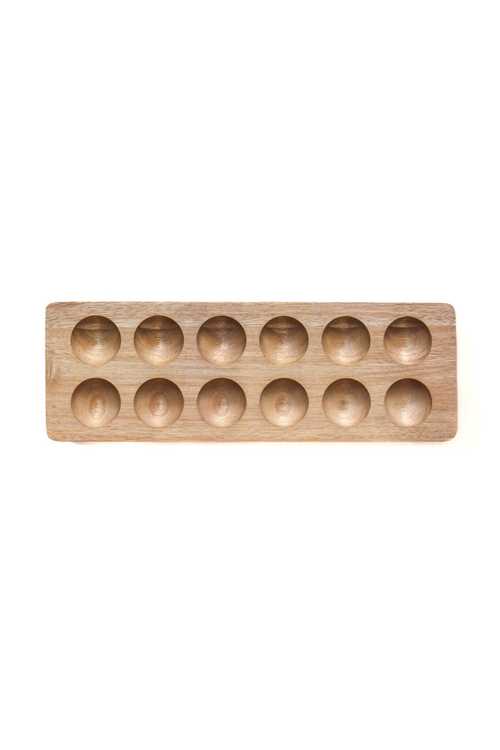 Natural wooden egg holding tray with 12 round wells