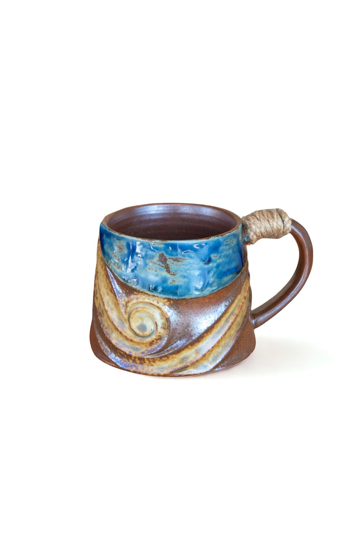 Rustic wave ceramic mug with blue glaze and rope-wrapped handle