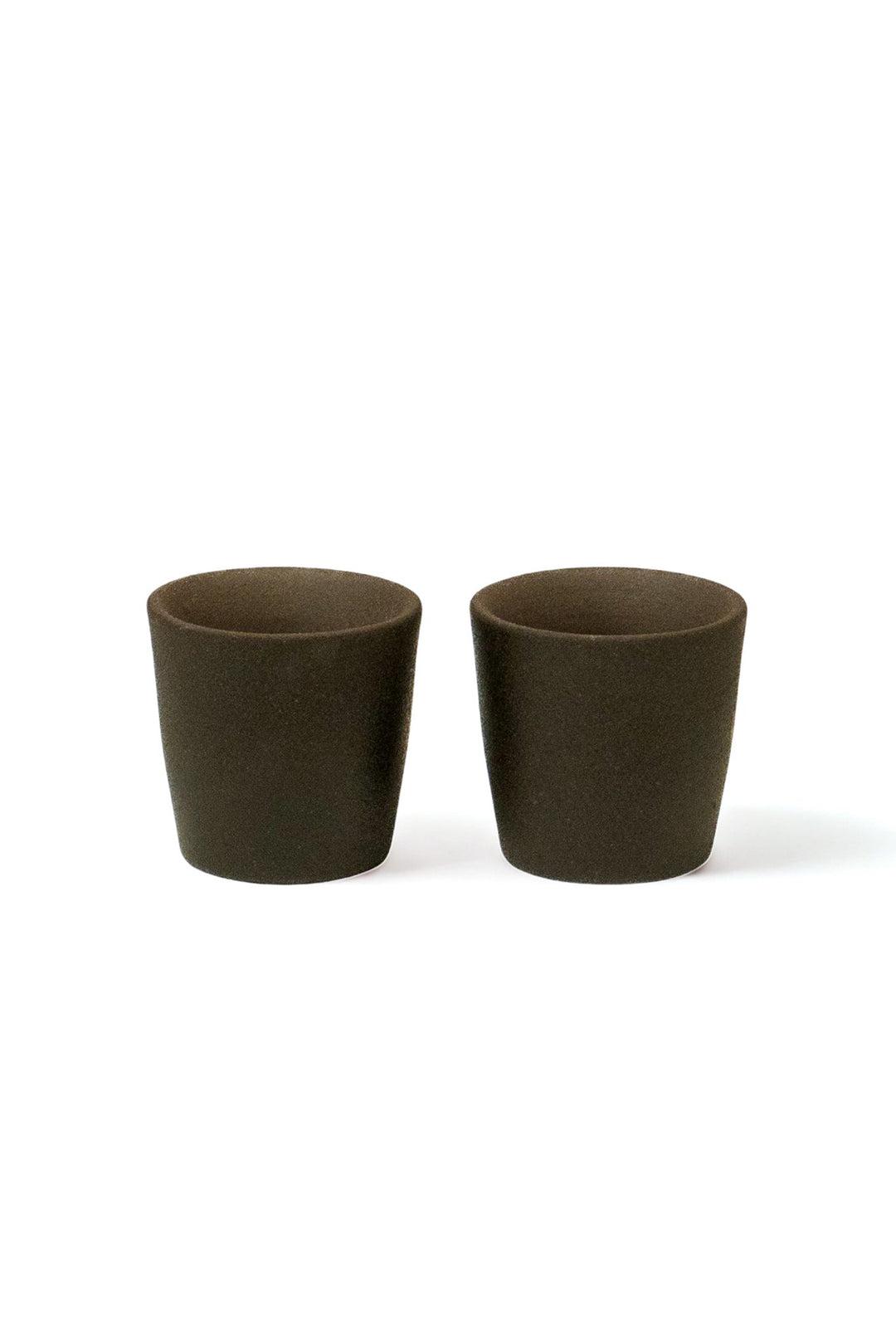 Set of 2 matte stoneware shot glasses with dark brown textured finish