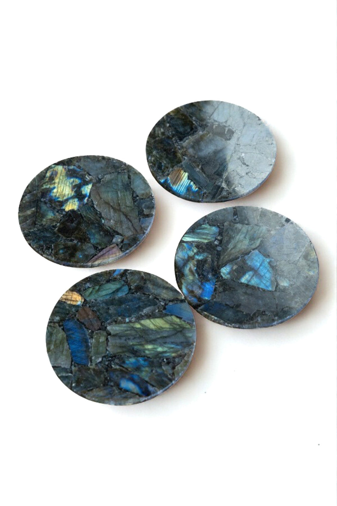 Set of round labradorite coasters with dark blue and gray iridescent stone