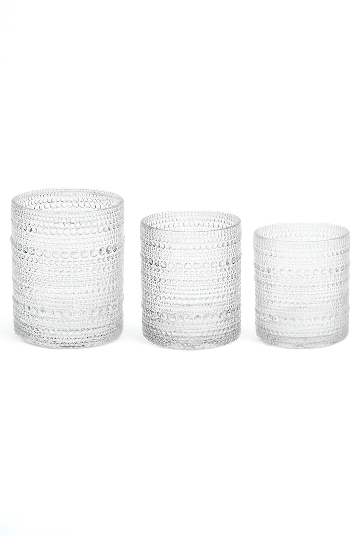 Bubbled glassware set of three clear cylinder cups with beaded texture, varying heights