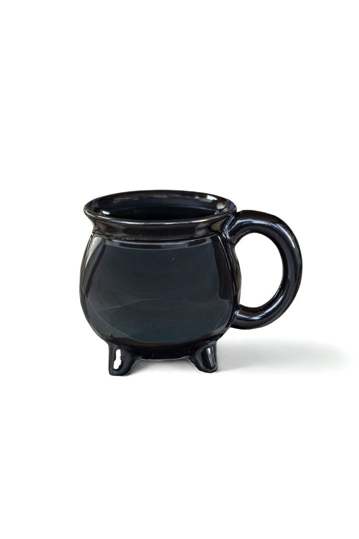 Black ceramic cauldron-style coffee mug with side handle and three small legs.