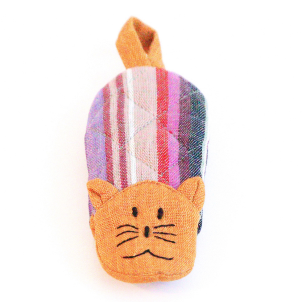 Cat skillet handle holder, orange cat head with striped fabric body and hanging loop.
