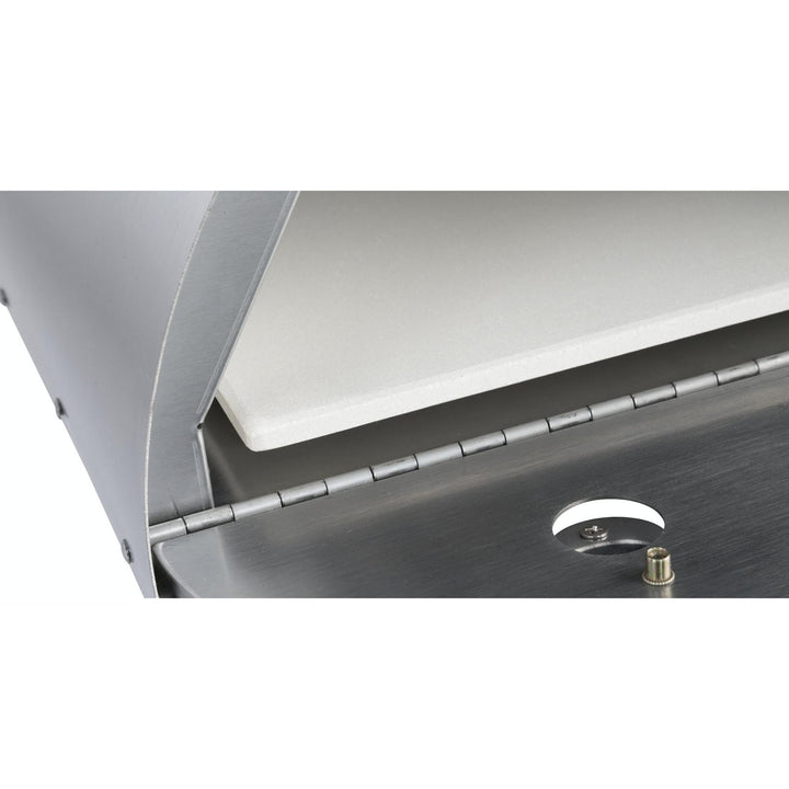Cordierite pizza stone installed in portable pizza oven with metal control knob