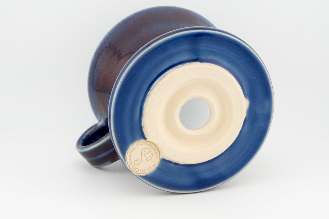 Ceramic coffee pour-over dripper base, deep blue speckled glaze with centered outlet