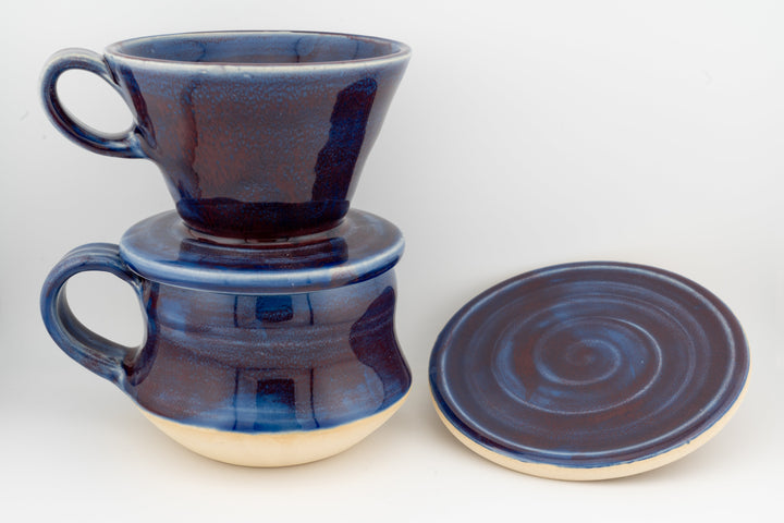Ceramic coffee mug set with coaster, two tall curvy mugs in dark blue glaze