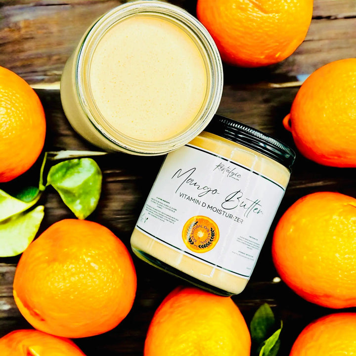 Vitamin D Mango Butter jar with open lid showing smooth cream inside