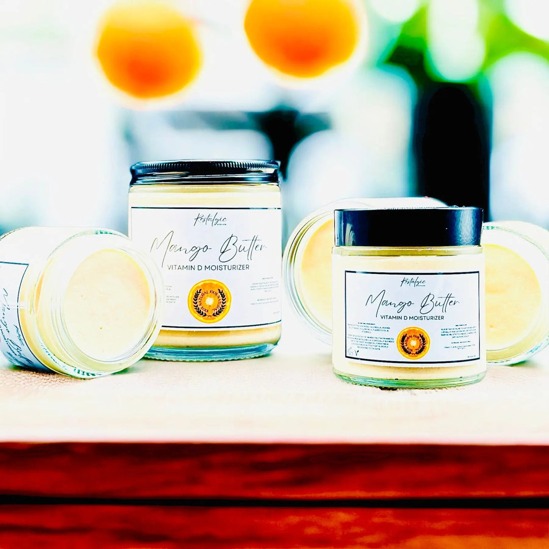 Vitamin D Mango Butter jars, one open, with smooth cream visible