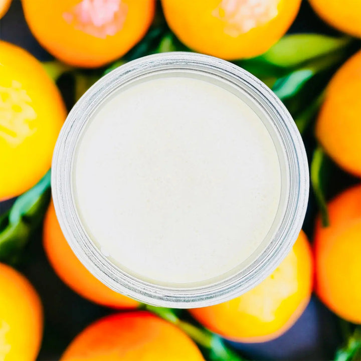 Vitamin D Mango Butter jar top view showing smooth cream surface