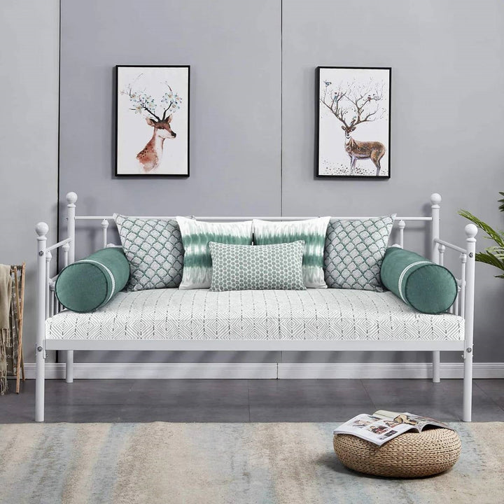 White metal twin daybed frame with round finials and slatted guardrails