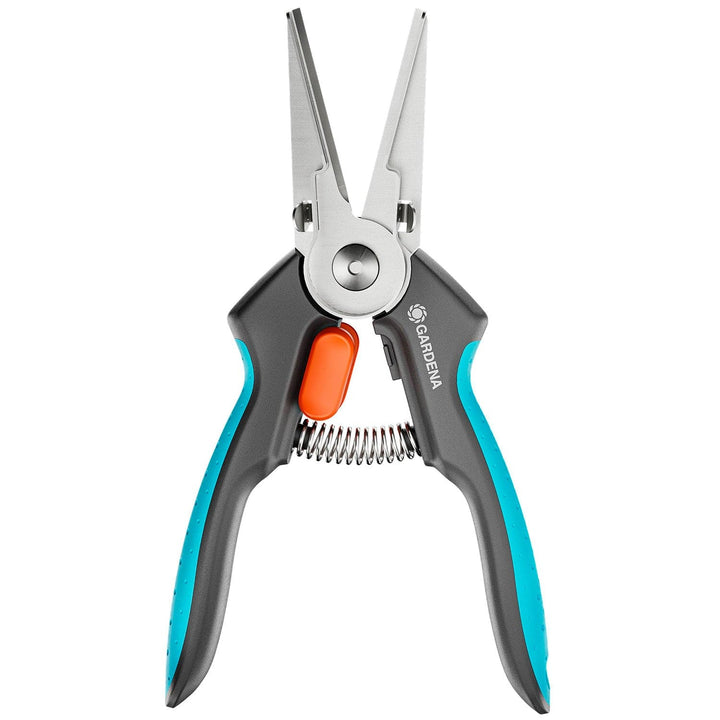 GripCut scissors close-up with blue handles and an orange button