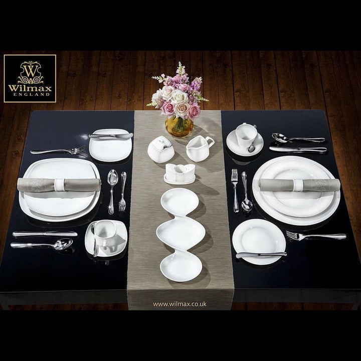 White 6 in rolled-rim bread plate shown in a full place setting