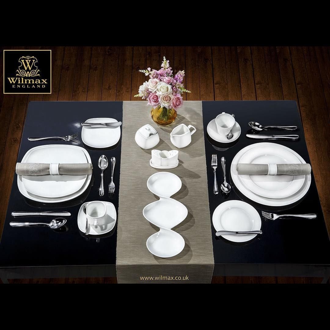 White 8-inch rolled-rim dessert plates shown as part of a tableware set.