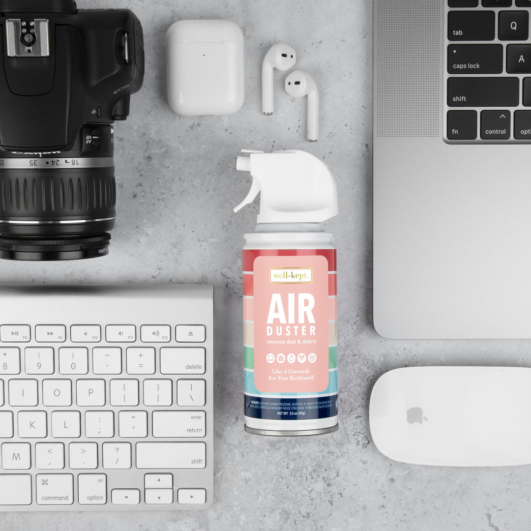 Mini compressed air duster can with straw nozzle, well-kept pastel label.
