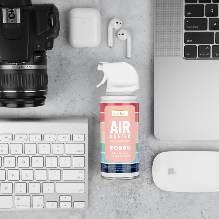 Mini compressed air duster can with straw nozzle, well-kept pastel label.