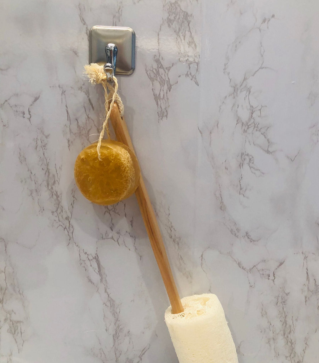 Loofah soap on a rope with round brown soap head and hanging loop