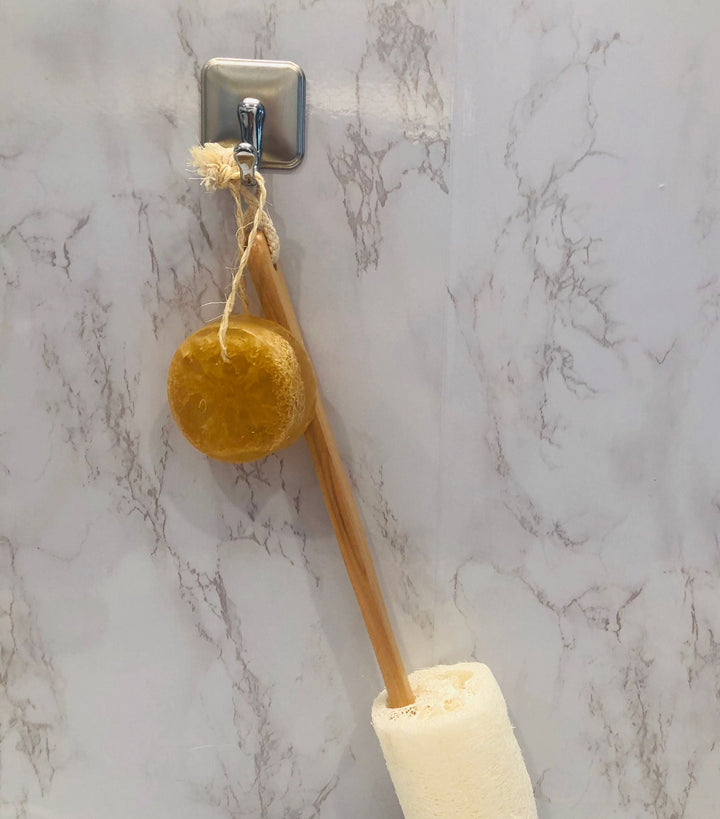 Loofah soap on a rope with round brown soap head and hanging loop