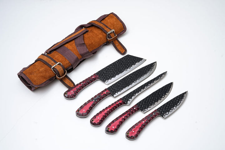 5-piece kitchen knife set with dark carbon-steel blades, red diamond handles, leather roll