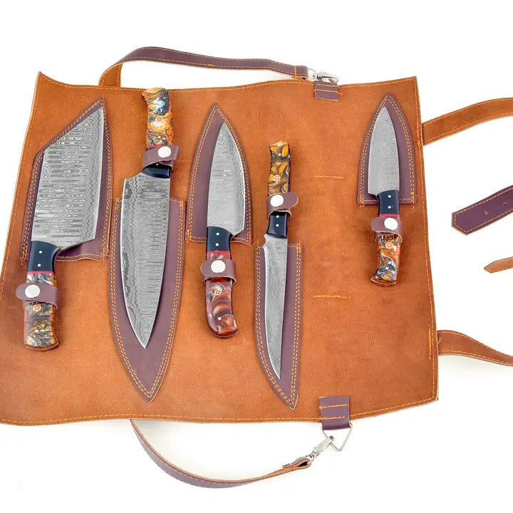Open leather knife roll showing 5 Damascus blades and blue, amber patterned handles