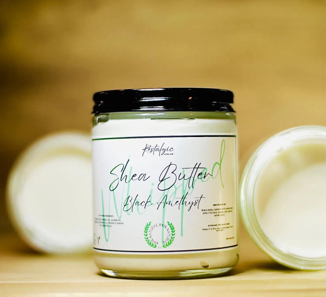 Whipped shea body butter jar with black lid; label on white container