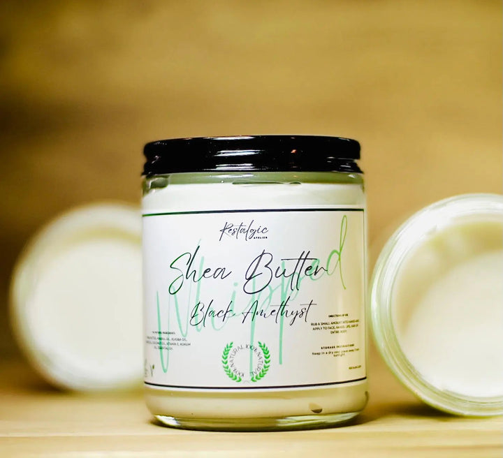 Whipped shea body butter jar with black lid; label on white container