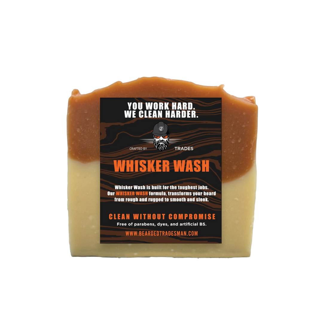 Whisker wash bar soap with cedar and amber color, rectangular label on front.