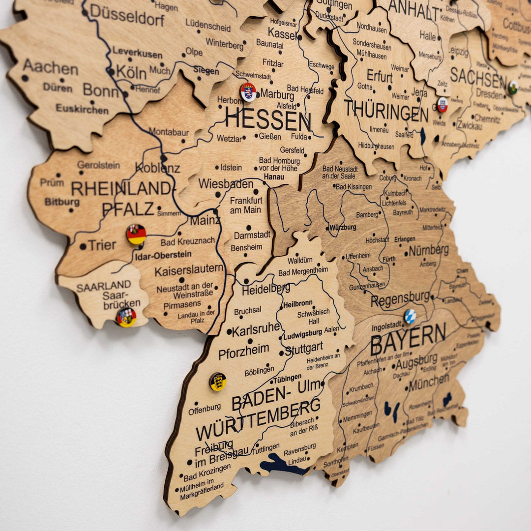 Wooden Germany map close-up with raised state boundaries and printed names