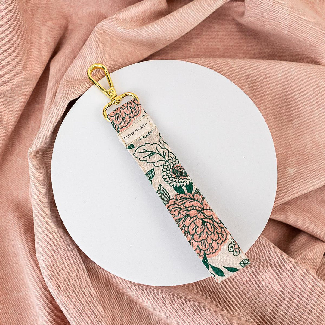Floral fabric wristlet keychain with gold ring and hanging strap