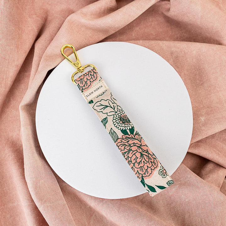 Floral fabric wristlet keychain with gold ring and hanging strap