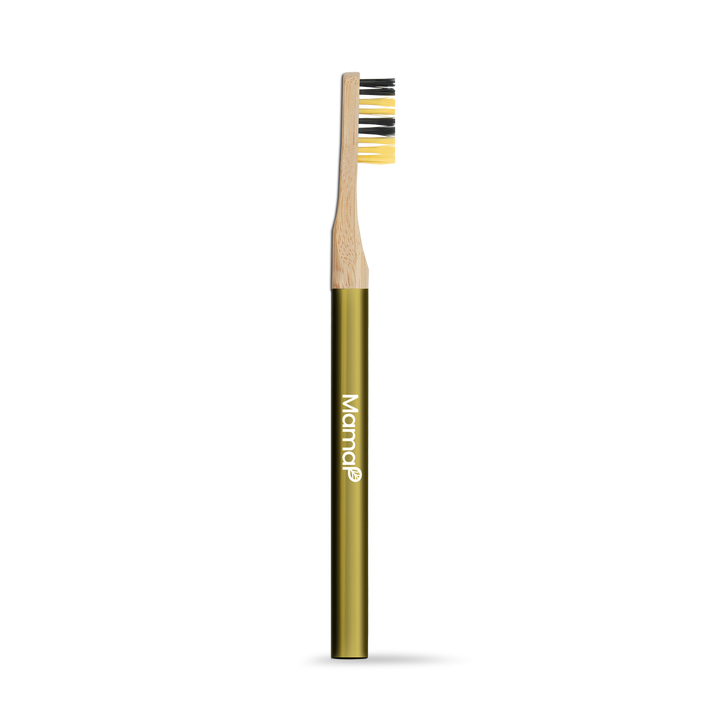 Manual toothbrush with bamboo handle and yellow bristles, shown upright.