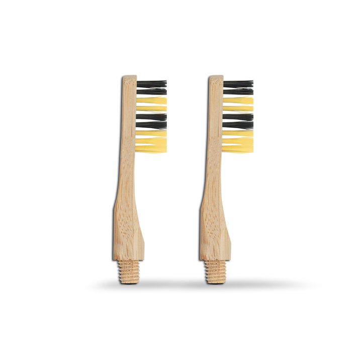 Revolve reusable bamboo toothbrush pair with yellow bristles and natural wood-look handles.