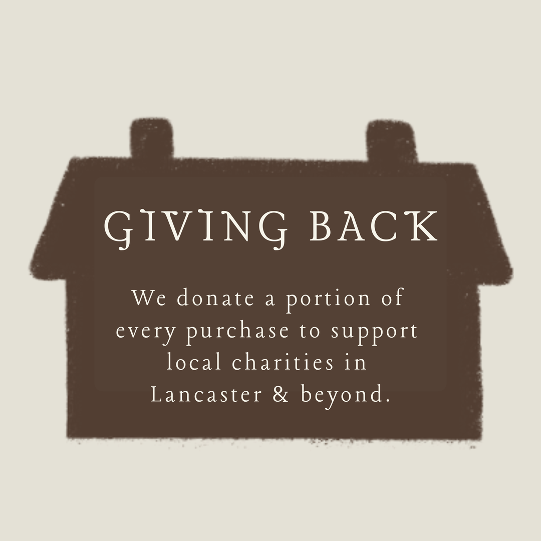 Giving Back donation message on a brown house-shaped sign